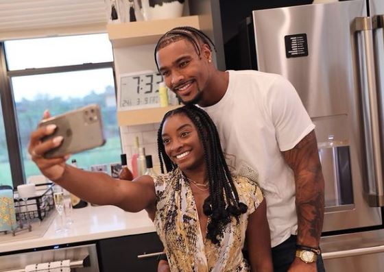 Owens with his fiancée Simone Biles