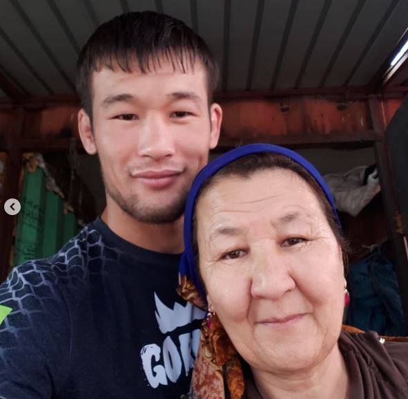 Shavkat Rakhmonov with his mother