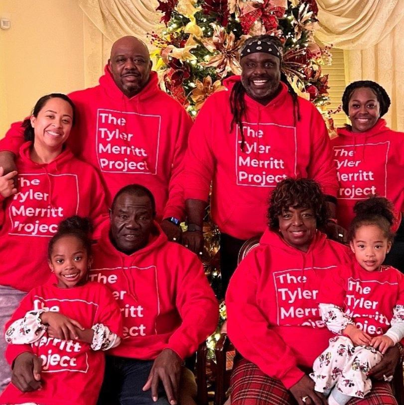 Tyler Merritt with his family members