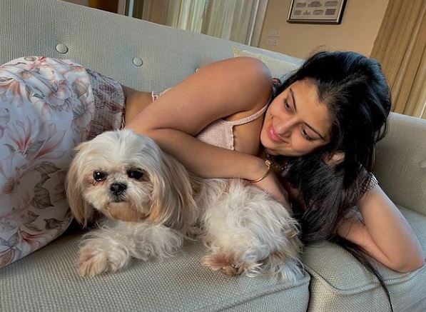 Zanai with her pet dog Coco