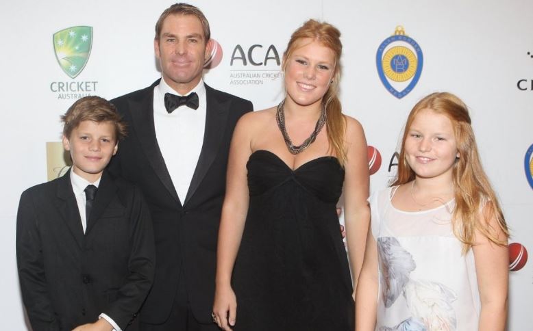 Brooke with her father Shane Warne and siblings