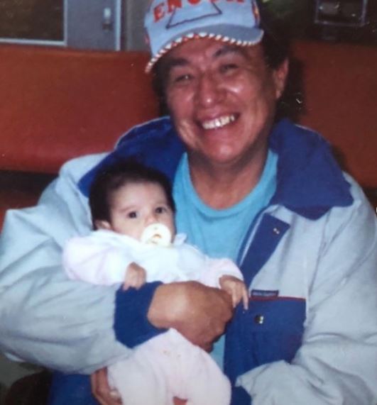 Childhood photo of Ashley with her grandfather