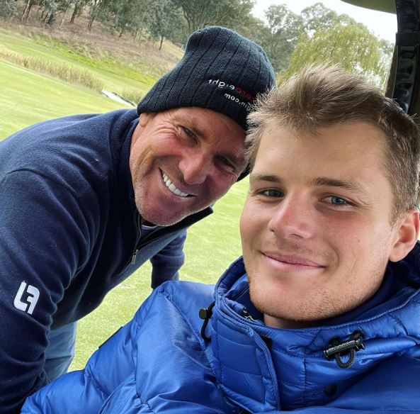 Jackson Warne with his father