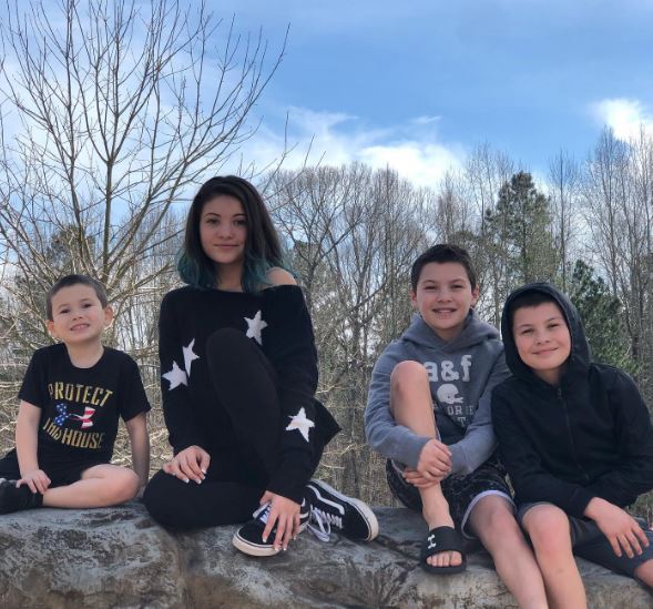 Jaden Walton with his sister and brothers