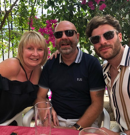 Jordan North with his father and mother