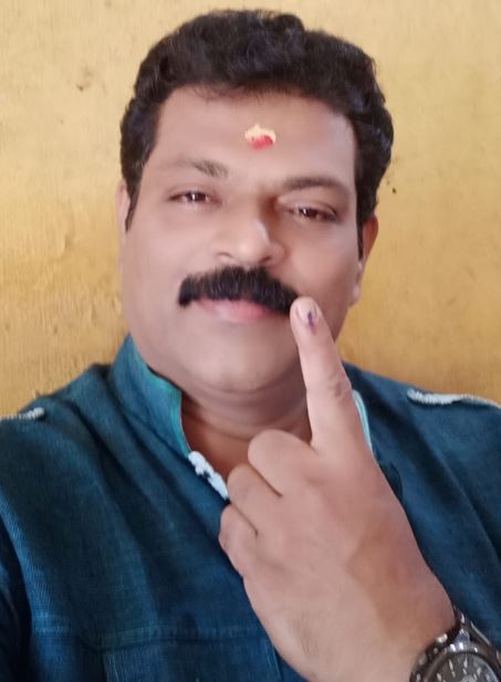 Manoj Nair uses his right to vote
