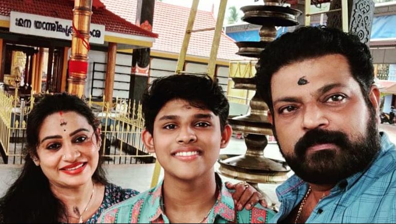 Manoj Nair with his spouse and son