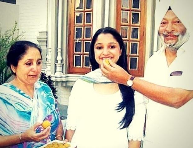Rukmani Riar with her father and mother