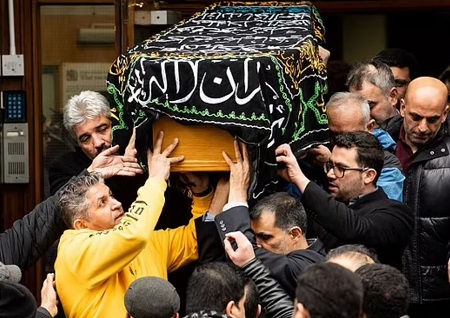 Yousef's body is carried out of a funeral ceremony