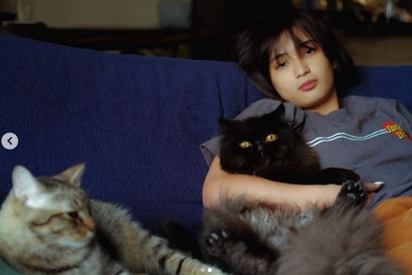 Aeriel with her pet cats