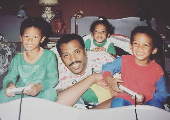 Childhood photo of Bobby Wooten III with his siblings and father