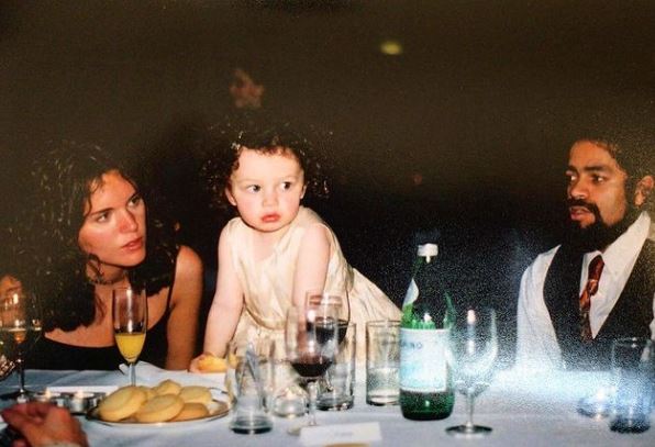 Childhood photo of Isis with her parents