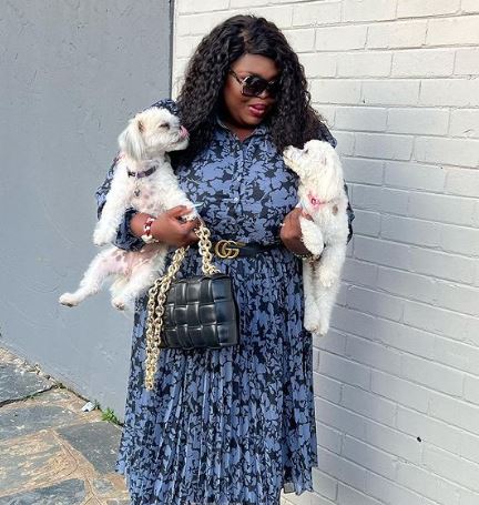 Maweni with her pet dogs