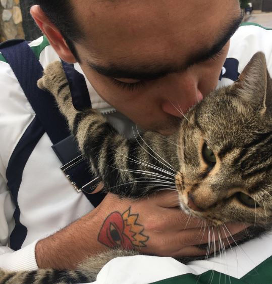Omar Ayuso and his pet cat Kyro