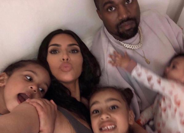 Saint with his mother Kim Kardashian, father Kanye West, and siblings