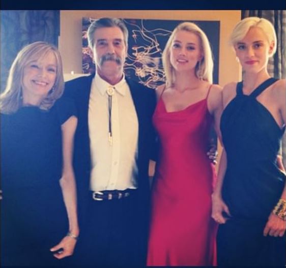 Whitney with her dad David Clinton Heard, mom Paige Heard, and sister Amber Heard