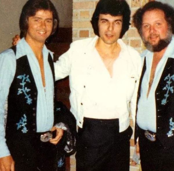An old photo of Larry with his friends