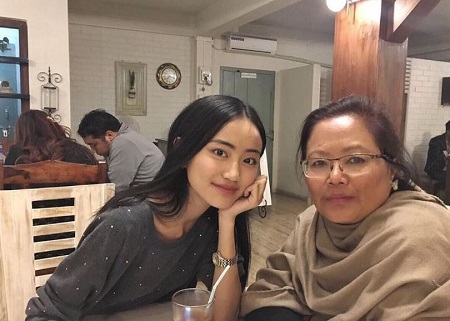 Carol Andrea Kevichusa with her mother