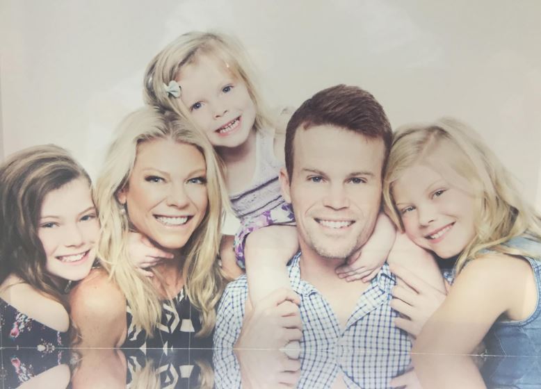 Erin Plummer with her husband and daughters