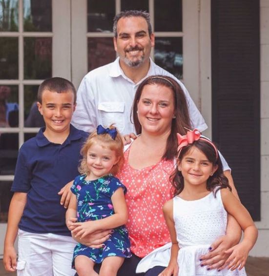Jacy with her parents and siblings