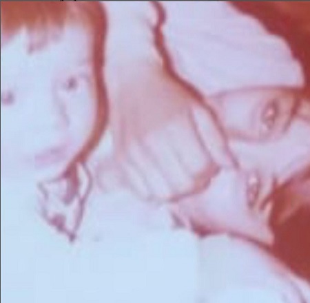Mariana Genesio Pena picture from her childhood siting with her mother