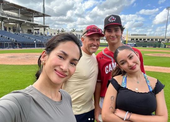 Erika with her parents and brother