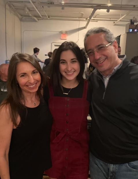 Isabel with her parents Luis Machado and Marcy Pollack Machado