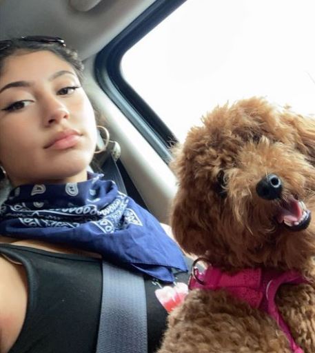 Isabella with her pet dog