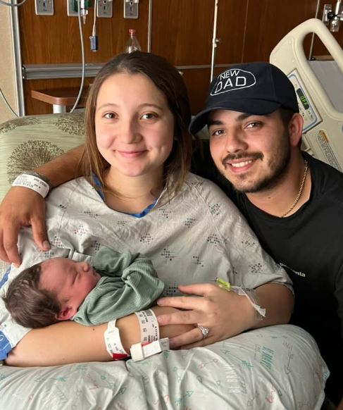 Lane Fernandez with his wife and son