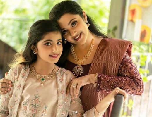Meena with her daughter