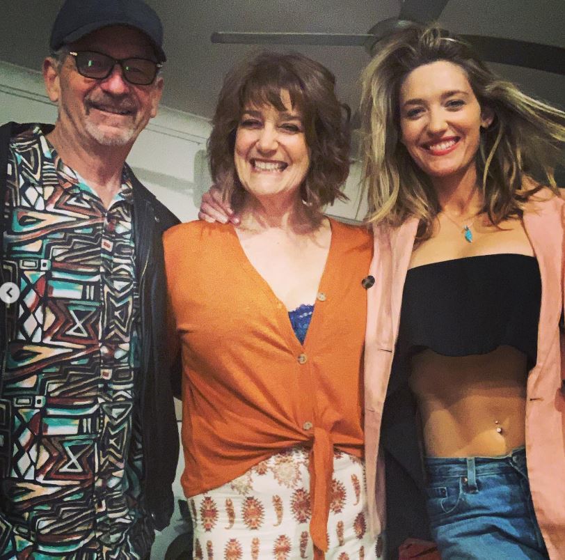 Tess Haubrich with her dad and mom