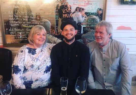 Tom with his parents Stephen Mann and Gill Mann