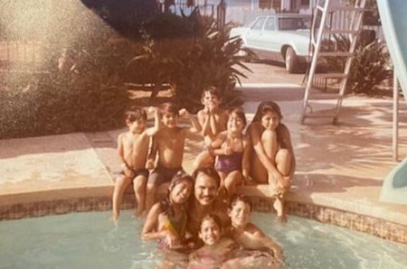 Ceci Truman with her father and with her 7 young siblings