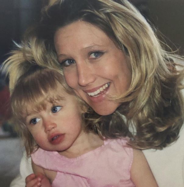 Childhood photo of Logan with her mom