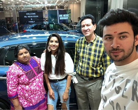 Neha Khan with her parents and brother while purchasing her first car