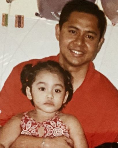 Childhood photo of Bella with her dad