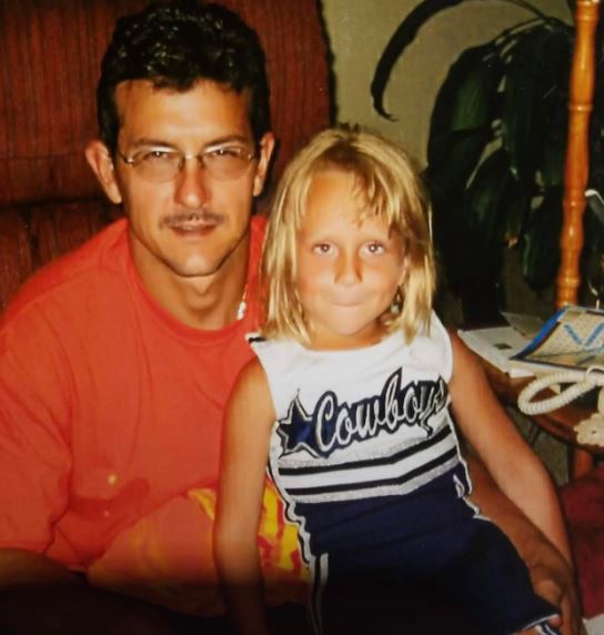 Childhood photo of Taylor with her dad