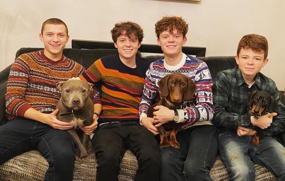 Sam Holland with his brothers