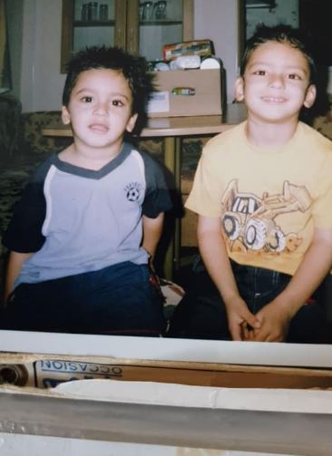 Adam Azim childhood image with his elder brother