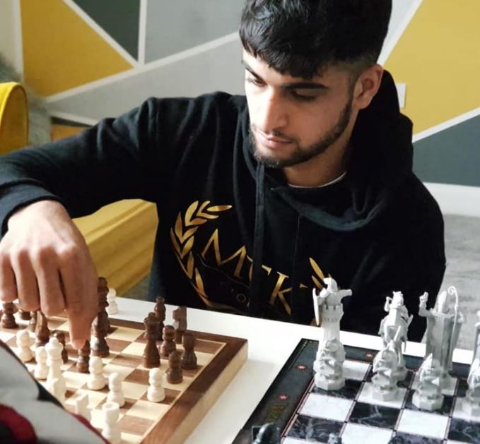 Adam Azim likes to play Chess