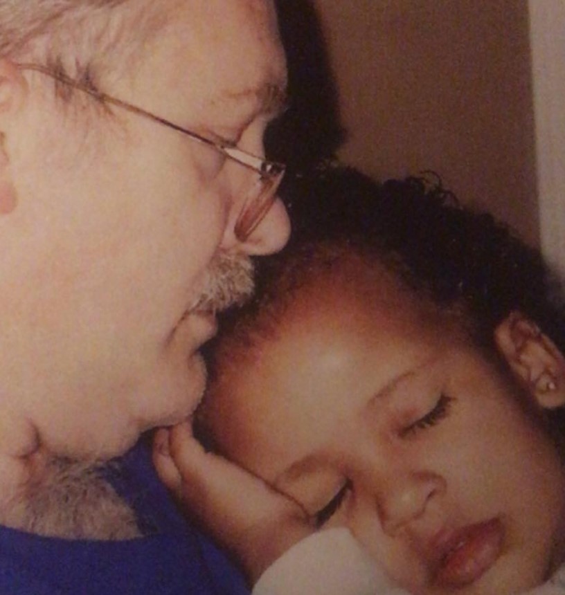 Childhood image of Breanna Akili with her father