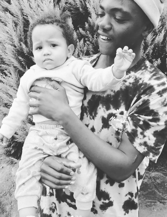 Childhood image of Uncle Waffles with her family member