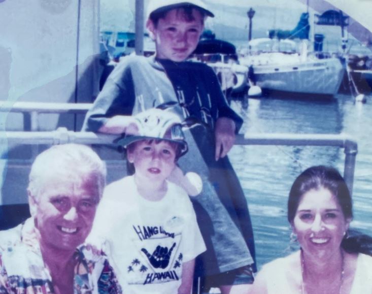 Jamie Roy old image with his dad mom and brother