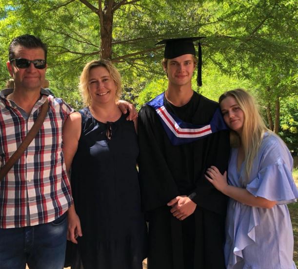 Luke with his parents and sister
