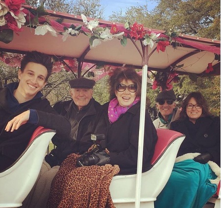 Richard Roat sitting in center with is wife Kathy Roat
