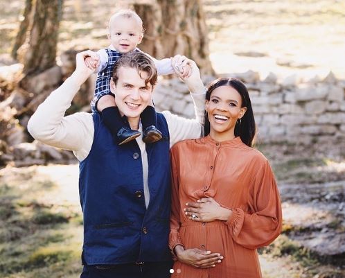 George with his son and wife Candace Owens