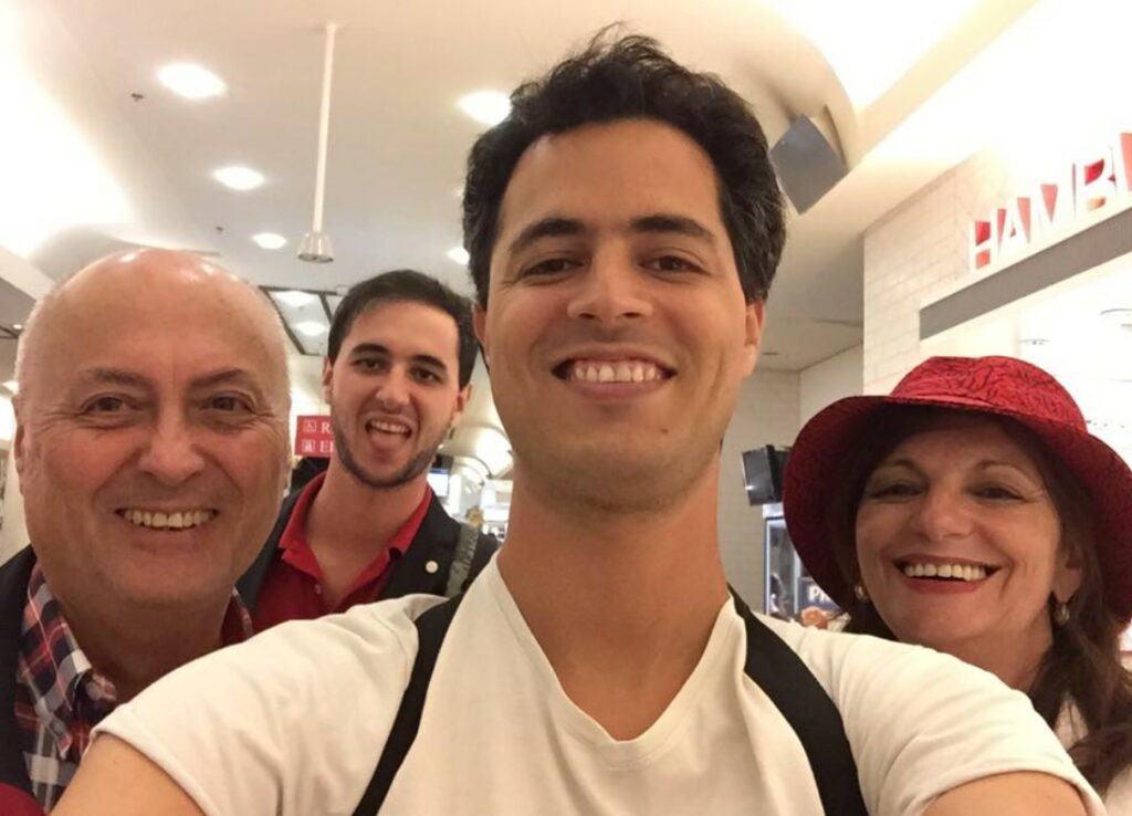 Kelly Olmos with his husband and sons