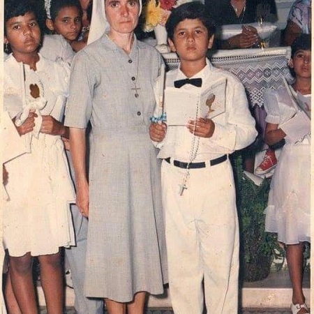 Padre Kelmon in his school