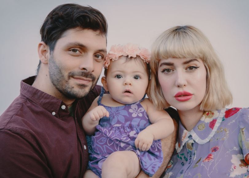 Amy Roiland with her husband and daughter
