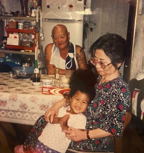 Childhood photo of Yasuka with her grandparents
